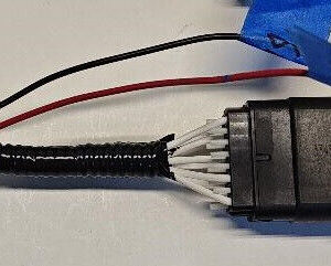 Electrical connectors with wires and blue tape.