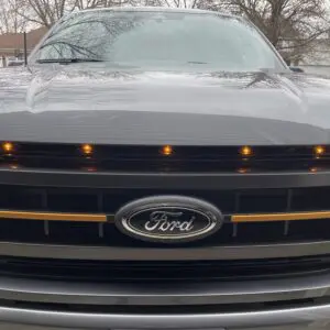 Front view of a ford car with some yellow lights